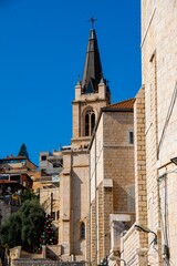 Fototapeta premium Picturesque street of stone buildings in the streets of Nazareth, Galilee, Israel.