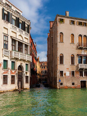 View of Rio della Maddalena (Magdalene's Canal) from Grand Canal, a characteristic Venice canal in...