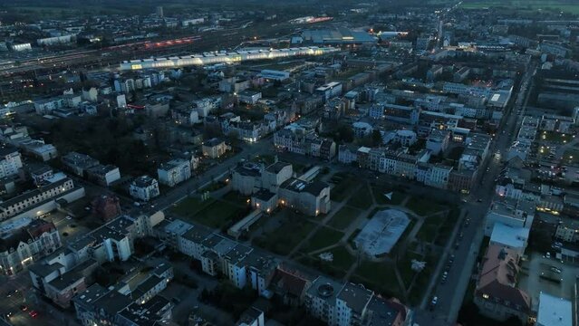 Drone flight above Cottbus cityscape during a blue hour in Germany