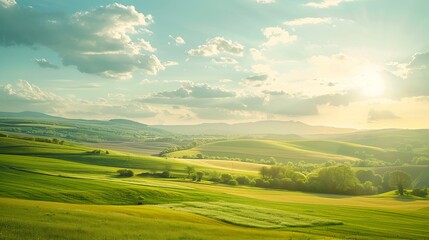 Stunning green landscape with rolling hills under a cloudy sky and sun shining brightly, perfect...