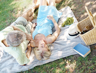 Mature couple, love and picnic for summer in park with man, woman and retirement. Sunshine,...