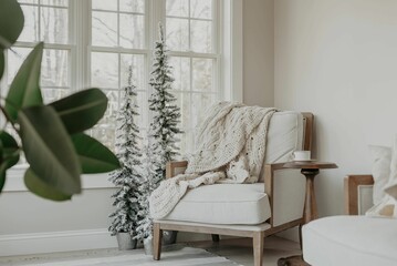 Cozy armchair situated with a blanket draped on it in the corner of a room near a window