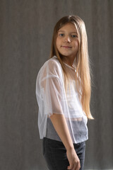 Studio portrait of a 10 year old long-haired girl.