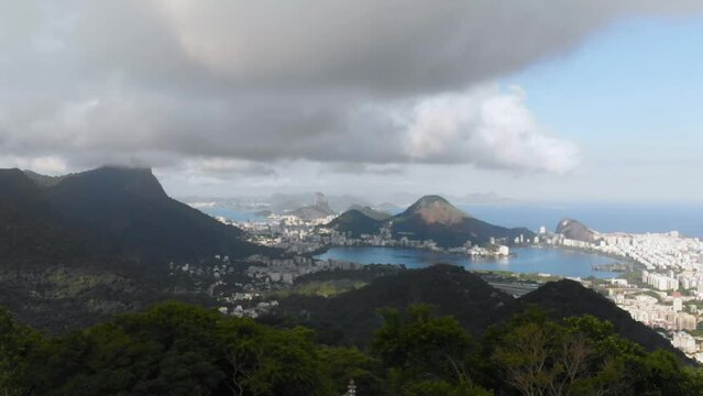 Landscape scene of Rocinha green mountains in the sea under cloudy sky in Rio de Janeiro, Brazil
