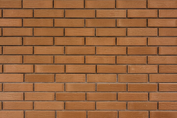 Close-up of a textured brown brick wall