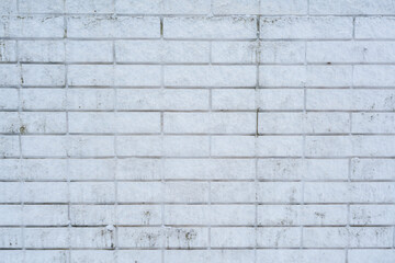 Close-up of a textured white brick wall