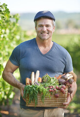 Agriculture, farming or produce and portrait of man with basket for organic harvest outdoor in...