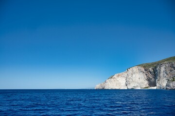Tranquil blue waters of Capri, Italy, lapping against the majestic cliffs, Greece, Zakynthos
