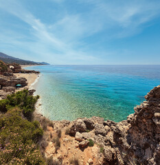 Sandy Drymades beach, Albania. Summer Ionian sea coast view. People are unrecognized.