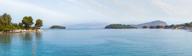 Summer morning sea coast view from Paradise Beach (Ksamil, Albania). People are unrecognizable. 