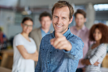 Happy, businessman and hand pointing for good job, praise or positive feedback at team meeting in...