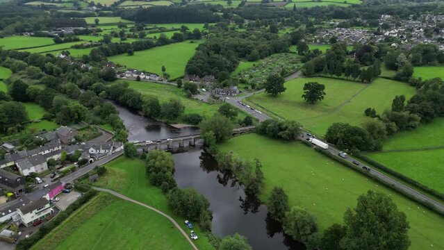 High drone shot of the historical Crickhowell Bridge spans the River Usk in Crickhowell, Wales, UK