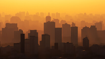 Naklejka premium building city shadow sunset office building background business city with sunset urban in the shadow land