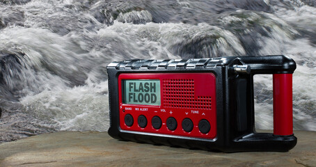 Weather service issued flash flood watch showing on a radio