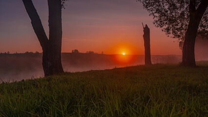 Sunrise over the Suprasl River at the boulevard in Suprasl.