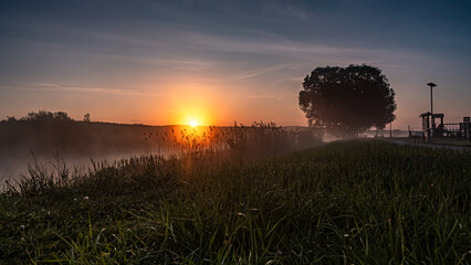 Sunrise over the Suprasl River at the boulevard in Suprasl.