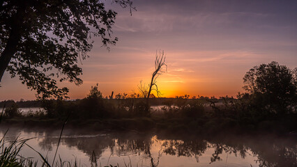 Sunrise over the Suprasl River at the boulevard in Suprasl.