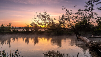 Sunrise over the Suprasl River at the boulevard in Suprasl.