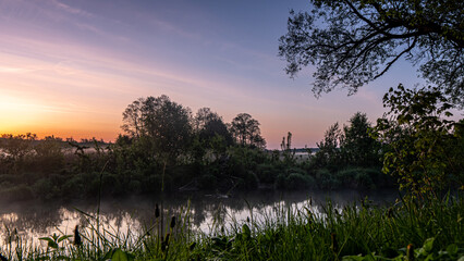 Sunrise over the Suprasl River at the boulevard in Suprasl.