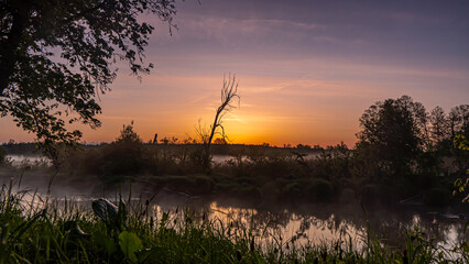 Sunrise over the Suprasl River at the boulevard in Suprasl.