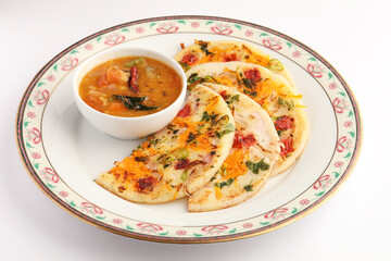 Uthappam or uttapam is a type of dosa from South India which is thicker, with tomato, onion and chilli toppings