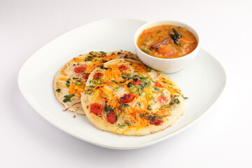 Uthappam or uttapam is a type of dosa from South India which is thicker, with tomato, onion and chilli toppings