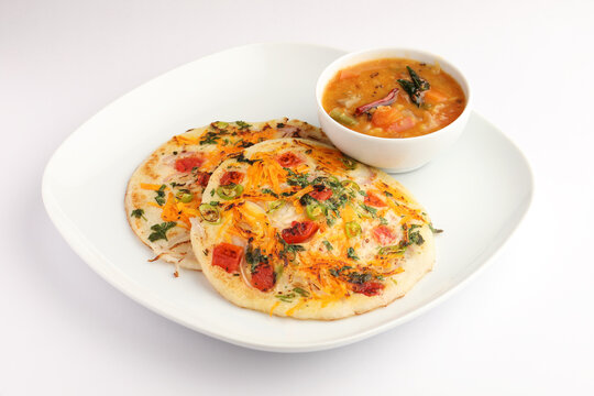 Uthappam or uttapam is a type of dosa from South India which is thicker, with tomato, onion and chilli toppings