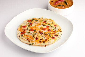 Uthappam or uttapam is a type of dosa from South India which is thicker, with tomato, onion and chilli toppings