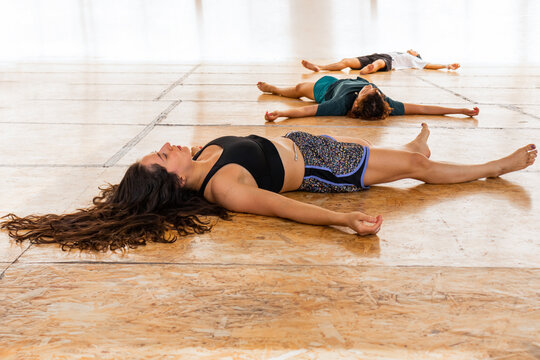 Participants in Restful Poses at Holistic Dance Ceremony