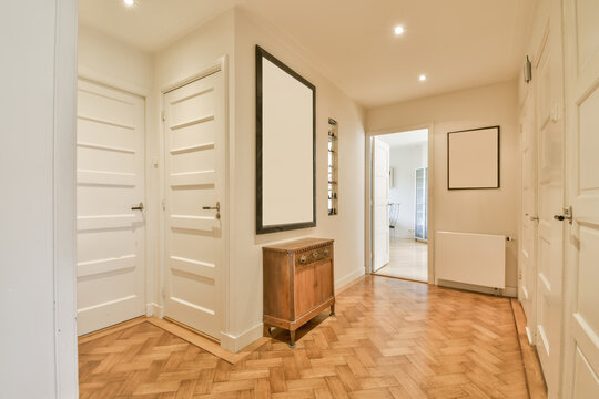 Bright empty hallway with herringbone parquet floor