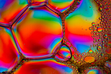 extremely colourful macro image of soap bubbles