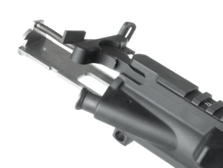 AR-15 .22 rimfire conversion bolt carrier group being installed inside the lower receiver of the assault rifle