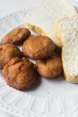 Akara and bread on a white plate, nigerian akara fried beans cake and bread on a plate 