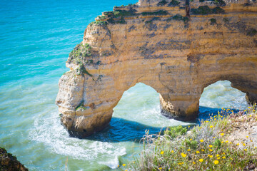 Natural arches at Praia da Marinha on the southern Algarve coast in Portugal