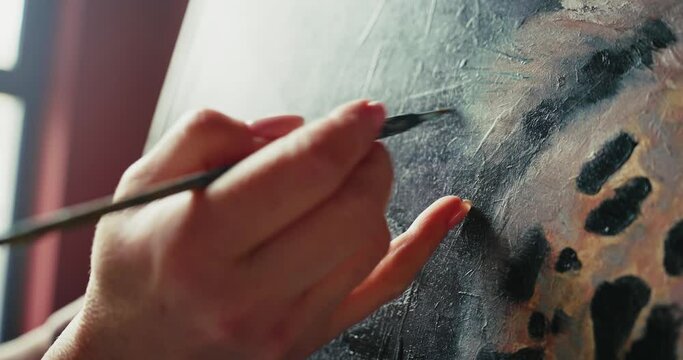 Artist Painting Leopard in Studio