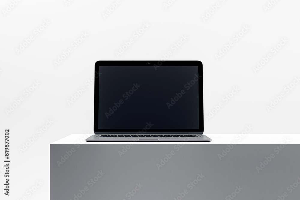 Poster sleek laptop on minimalist pedestal, displaying a blank screen, ideal for technology and device pres
