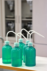 green plastic dosing bottles, for dosing water and other liquids laboratory equipment