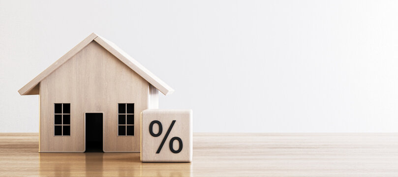 Simple wooden house and percentage block, depicting concepts of mortgage and interest rates. 3D Render