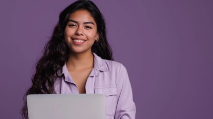 Portrait of a joyful young Hispanic woman, self-employed and successful, posing with a laptop...