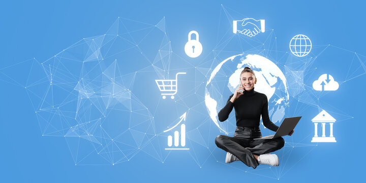 A person with a laptop sitting against a blue background with digital icons and a global network graphic overlaying, symbolizing connectivity and technology