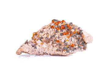 Spessartine garnet on feldspar with quartz, from China. photography isolated on white blackground. macro detail  background. close-up Rough raw unpolished semi-precious gemstone.
