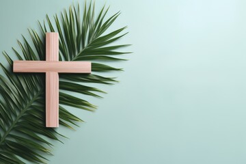 Palm sunday concept with palm tree branches and wooden christian cross for easter celebration