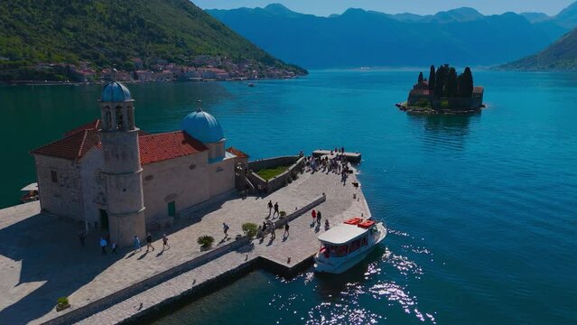The unique island of St. George and the Church of Gospa od &Scaron;krpela (Madonna on the Reef). Bay of Kotor, Perast, Montenegro. Amazing mountain landscape. Beautiful Bay of Kotor. Drone video, 4k.