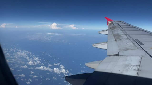 Airplane travel, airplane wings in the sky from the window