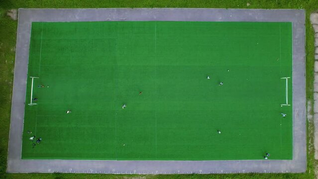 Children practicing on the green soccer field