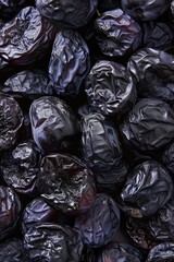 A close-up view of a pile of dried plums. Suitable for food and nutrition concepts