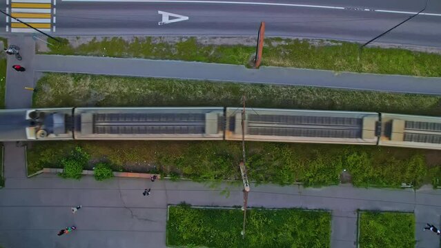 Railroad along the highway and a passing train
