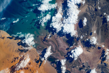 Clouds coastline in Gulf of California, Mexico. Digital enhancement of an image by NASA