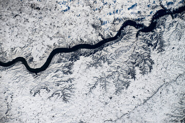 Snow in land with river, South Dakota, USA. Digital enhancement of an image by NASA