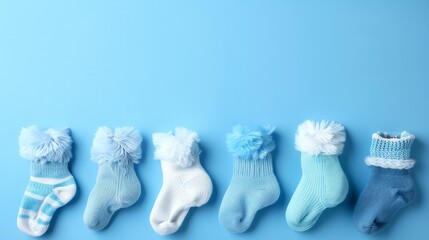 A row of baby socks with blue and white stripes